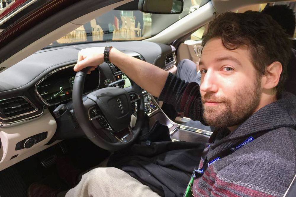 Aaron Birch sitting in a 2017 Lincoln Continental