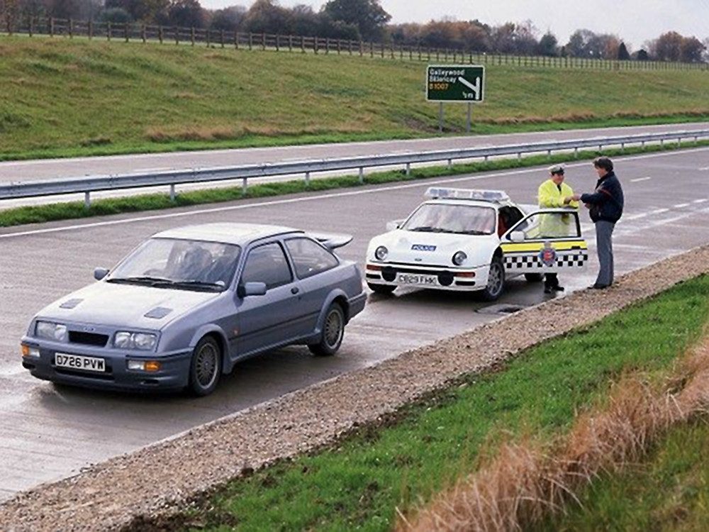 Police Ford RS200 pulls over a Sierra RS Cosworth