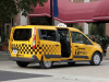 2014-ford-transit-connect-taxi-exterior-005-rear-three-quarters