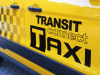 2014-ford-transit-connect-taxi-exterior-008-transit-connect-taxi-logo-on-front-door