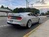 2019-ford-mustang-saleen-s302-white-label-ford-authority-garage-exterior-089-rear-three-quarters-saleen-logo-script-on-decklid