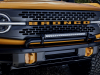 2021-ford-bronco-2-door-cyber-orange-metallic-tri-coat-exterior-017-front-grille-detail-tow-hooks-headlights-light-bar