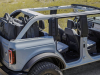 2021-ford-bronco-4-door-cactus-gray-exterior-020-doors-off-stowed-in-trunk-all-roof-panels-off-rear-quarter-window-removed