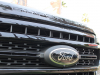 2020-ford-f-250-super-duty-lariat-with-sport-package-and-tremor-package-exterior-002-black-ford-badge-logo