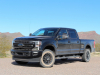 2020-ford-f-250-super-duty-lariat-with-sport-package-exterior-002-black-front-three-quarters-first-drive
