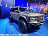 2021-ford-bronco-outer-banks-4-door-by-baja-forged-2021-sema-live-photos-exterior-008-front-three-quarters-rigid-light-bar-warn-winch-baja-forged-tubular-front-bumper-afc-fenders-method-race-wheels