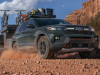 2021-ford-explorer-timberline-exterior-011-front-three-quarters-off-road-towing-campign-trailer-with-bikes-loaded-roof-rack