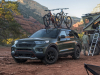 2021-ford-explorer-timberline-exterior-013-front-three-quarters-off-road-camping-camping-trailer-bikes-on-roof-rack