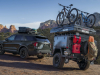 2021-ford-explorer-timberline-exterior-018-rear-three-quarters-off-road-towing-campign-trailer-with-bikes-loaded-roof-rack