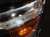 2021-ford-explorer-timberline-forged-green-2021-chicago-auto-show-exterior-009-explorer-script-logo-in-headlamp