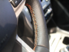 2021-ford-explorer-timberline-interior-003-steering-wheel-deep-tangerine-stitching