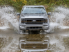 2021-ford-f-150-lariat-tremor-exterior-017-front-end-driving-through-water