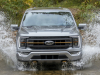 2021-ford-f-150-lariat-tremor-exterior-018-front-end-driving-through-water