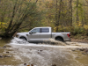 2021-ford-f-150-lariat-tremor-exterior-020-side-profile-driving-through-water