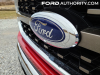 2021-ford-f-150-king-ranch-rapid-red-d4-fa-garage-exterior-009-blue-oval-emblem