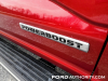 2021-ford-f-150-king-ranch-rapid-red-d4-fa-garage-exterior-014-powerboost-logo-badge