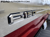 2021-ford-f-150-king-ranch-rapid-red-d4-fa-garage-exterior-029-f-150-logo-badge-on-tailgate