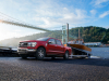 2021-ford-f-150-lariat-exterior-003-front-three-quarters-pulling-boat-out-of-lake