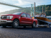 2021-ford-f-150-lariat-exterior-004-front-three-quarters-pulling-boat-out-of-lake