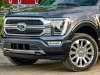 2021-ford-f-150-limited-exterior-003-front-three-quarters-grille-headlights