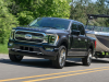 2021-ford-f-150-limited-exterior-022-front-three-quarters-towing-boat