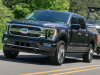 2021-ford-f-150-limited-exterior-023-front-three-quarters-towing-boat
