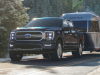 2021-ford-f-150-limited-exterior-030-front-three-quarters-towing-airstream-trailer