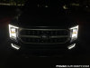 2021-ford-f-150-platinum-powerboost-fa-garage-night-exterior-005-front-headlights-drls-primary-headlights
