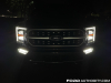 2021-ford-f-150-platinum-powerboost-fa-garage-night-exterior-006-front-headlights-drls-primary-headlights-fog-lights