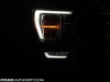 2021-ford-f-150-platinum-powerboost-fa-garage-night-exterior-008-front-headlight-drl-passenger-side