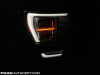 2021-ford-f-150-platinum-powerboost-fa-garage-night-exterior-009-front-headlight-drl-passenger-side