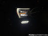 2021-ford-f-150-platinum-powerboost-fa-garage-night-exterior-010-front-headlight-drl-primary-headlight-fog-light-passenger-side