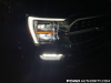 2021-ford-f-150-platinum-powerboost-fa-garage-night-exterior-011-front-headlight-drl-primary-headlight-fog-light-passenger-side