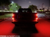 2021-ford-f-150-platinum-powerboost-fa-garage-night-exterior-019-rear-tail-lights-tailgate-down