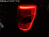 2021-ford-f-150-platinum-powerboost-fa-garage-night-exterior-028-rear-tail-light-passenger-side