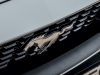 2021-ford-mustang-mach-1-appearance-package-europe-exterior-fighter-jet-gray-021-mustang-pony-logo-on-grille