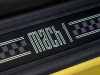 2021-ford-mustang-mach-1-europe-interior-grabber-yellow-008-mach-1-logo-on-door-sill