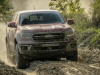 2021-ford-ranger-tremor-lariat-exterior-012-front-three-quarters-in-mud-and-dirt