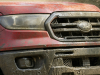 2021-ford-ranger-tremor-lariat-exterior-016-front-three-quarters-in-mud-grille-ford-logo