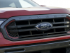 2021-ford-ranger-tremor-lariat-exterior-018-grille-with-ranger-script-red-nostrile-accents-ford-logo