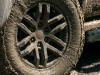 2021-ford-ranger-tremor-lariat-exterior-031-wheel-and-tire-in-mud