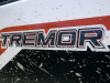 2021-ford-ranger-tremor-xlt-exterior-with-hood-and-body-graphics-009-tremor-logo-on-side-of-box