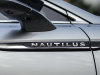 2021-lincoln-nautilus-reserve-silver-radiance-exterior-022-nautilus-logo-name-front-door