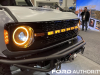 2022-ford-bronco-all-female-build-sema-2022-live-photos-exterior-005-grille-bronco-script-grille-drl-daytime-running-lights-headlights