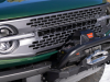 2022-ford-bronco-everglades-eruption-green-color-press-photos-exterior-011-front-end-gray-grille-with-black-bronco-lettering-high-performance-front-bumper-with-zeon-10-s-warn-winch-headlights