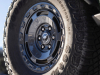2022-ford-bronco-everglades-eruption-green-color-press-photos-exterior-014-35-inch-goodyear-wrangler-territory-tire-17-inch-carbonized-gray-painted-alloy-wheels-bronco-logo-on-center-cap
