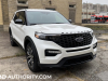 2022-ford-explorer-st-line-live-photos-exterior-021-front-three-quarters-headlights-grille-ford-logo-badge