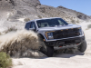 2023-ford-f-150-raptor-r-press-photos-exterior-051-avalanche-gray-front-three-quarters-kicking-up-sand