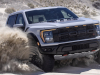 2023-ford-f-150-raptor-r-press-photos-exterior-052-avalanche-gray-front-three-quarters-kicking-up-sand