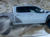 2023-ford-f-150-raptor-r-press-photos-exterior-062-avalanche-gray-side-jumping